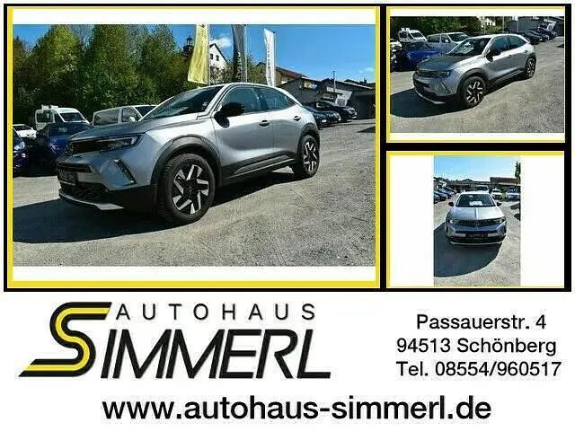 Kontrast grau/dach weiß (metallic) Gebraucht 2022 Opel Mokka-e Elegance SUV | 19.950 € (Fairer Preis) - Bild 1/4