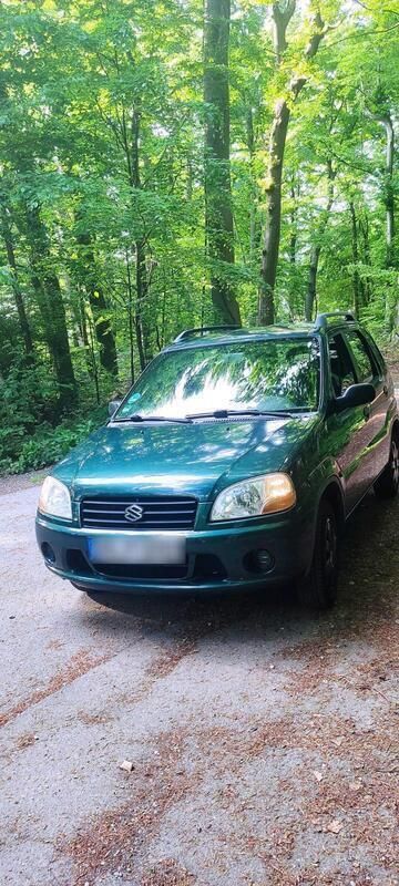 Grün Gebraucht 2001 Suzuki Ignis Kleinwagen | 1.111 € - Bild 1/4