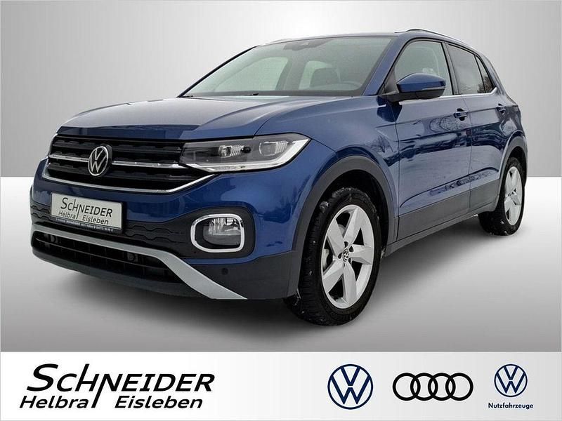 Reef blue (metallic) Gebraucht 2022 VW T-Cross Style SUV | 21.460 € (Fairer Preis) - Bild 1/4