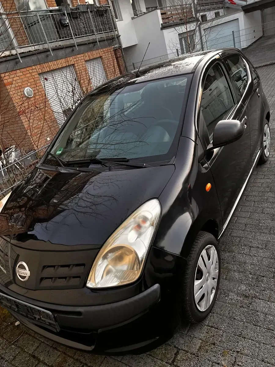 Gebraucht Nissan Pixo 68 PS (50 kW) 2010 Schwarz Kleinwagen