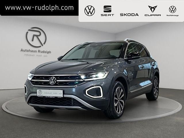 Indiumgrau metallic (metallic) Gebraucht 2022 VW T-Roc Style SUV | 20.879 € (Fairer Preis) - Bild 1/4