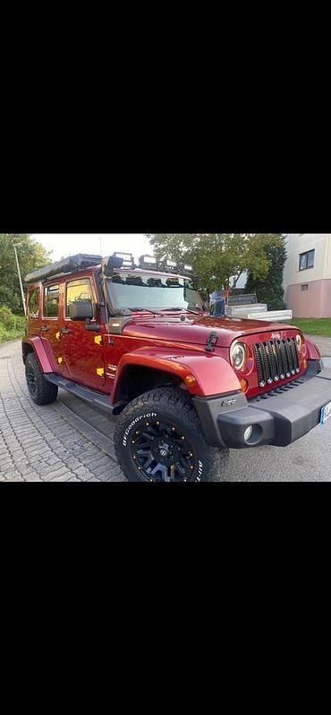 Rot Gebraucht 2011 Jeep Wrangler Sahara SUV | 24.750 € (Etwas zu teuer) - Bild 1/4