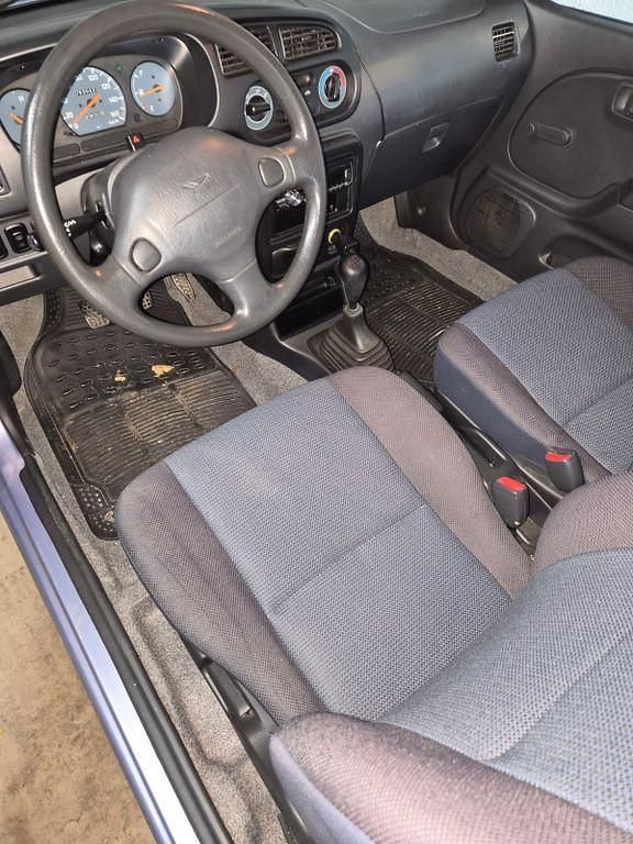 Gebraucht Daihatsu Cuore 56 PS (41 kW) 2003 Violet Kleinwagen