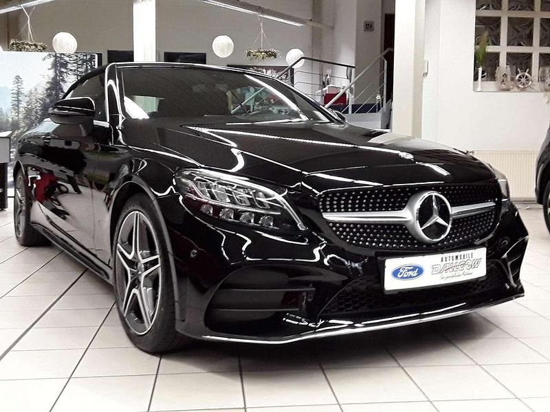 Iridiumschwarz Gebraucht 2020 Mercedes C200 AMG line Cabrio | 33.800 € (Fairer Preis) - Bild 1/4