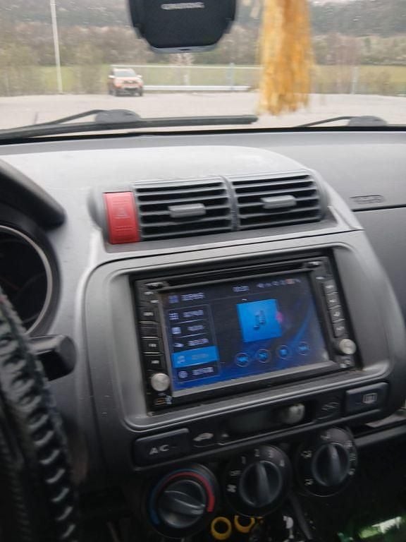 Second-hand Honda Jazz 77 CP (56 kW) 2004 Roșu Hatchback