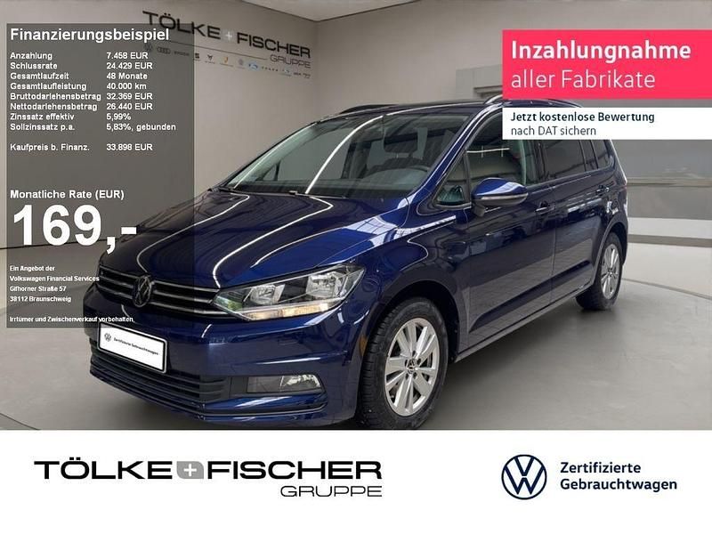 Blau Gebraucht 2024 VW Touran Comfortline Van / Kleinbus | 33.898 € (Fairer Preis) - Bild 1/4
