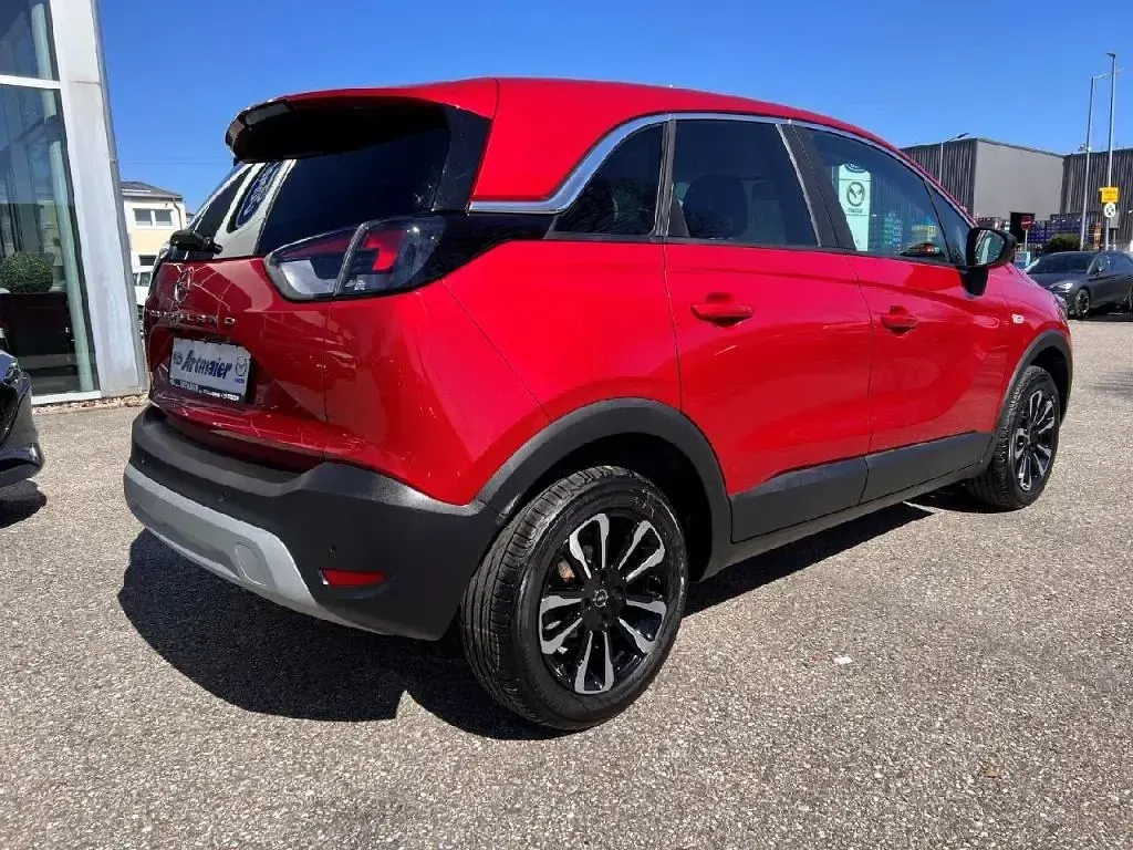 Gebraucht Opel Crossland X 131 PS (96 kW) 2023 Lackierung peperoncino red/metallic klar (metallic) SUV