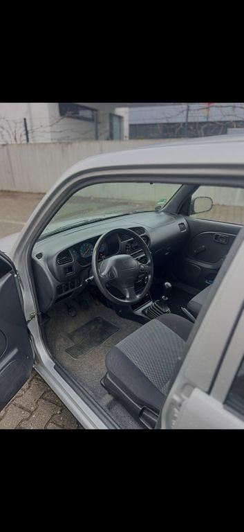 Gebraucht Daihatsu Cuore 58 PS (42 kW) 2003 Silber Kleinwagen