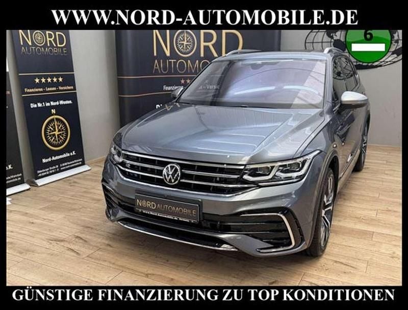 Platinum grey metallic (metallic) Gebraucht 2022 VW Tiguan Allspace R-line SUV | 35.700 € (Fairer Preis) - Bild 1/3