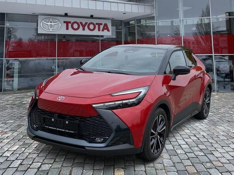 Emotional red 2 (3u5)/ black ( Gebraucht 2024 Toyota C-HR Lounge SUV | 34.990 € (Fairer Preis) - Bild 1/4