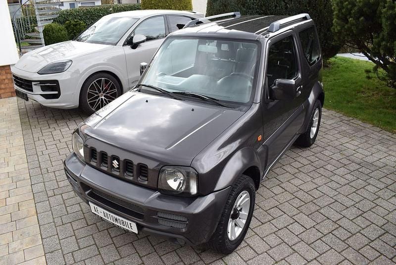 Usado Suzuki Jimny Style 86 HP (63 kW) 2012 Cinzento SUV