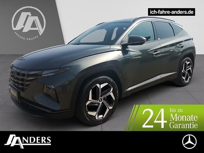 Grau Gebraucht 2021 Hyundai Tucson Prime SUV | 24.224 € (Etwas zu teuer) - Bild 1/3