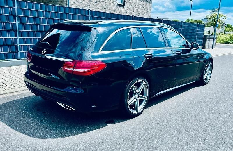 Schwarz Gebraucht 2016 Mercedes C220 AMG line Kombi | 14.880 € (Teuer) - Bild 1/4