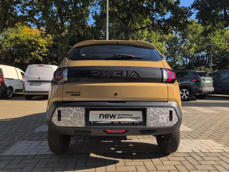 Gebraucht Dacia Spring Extreme 47 kW (65 PS) 2025 Safaribeige Kleinwagen