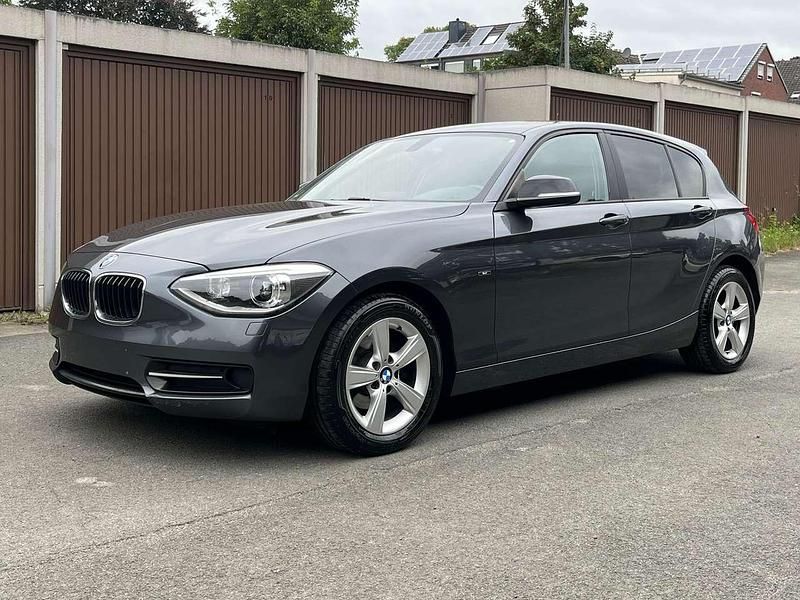 Mineralgrau metallic Gebraucht 2012 BMW 116 Sport Line Kleinwagen | 6.490 € (Fairer Preis) - Bild 1/4