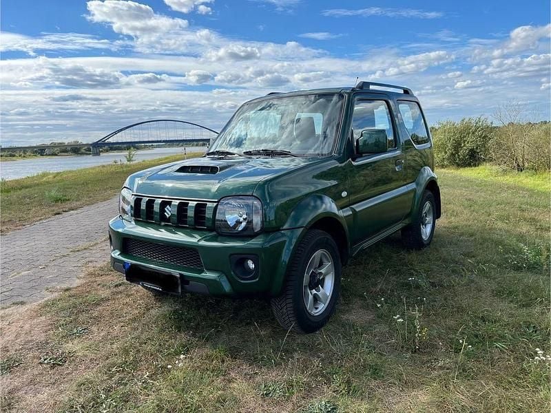Grün Gebraucht 2015 Suzuki Jimny Comfort SUV | 16.000 € (Fairer Preis) - Bild 1/4