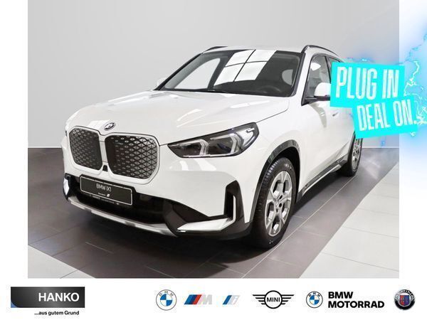 Black sapphire metallic Gebraucht 2024 BMW iX1 Luxury Line SUV | 45.334 € (Teuer) - Bild 1/3