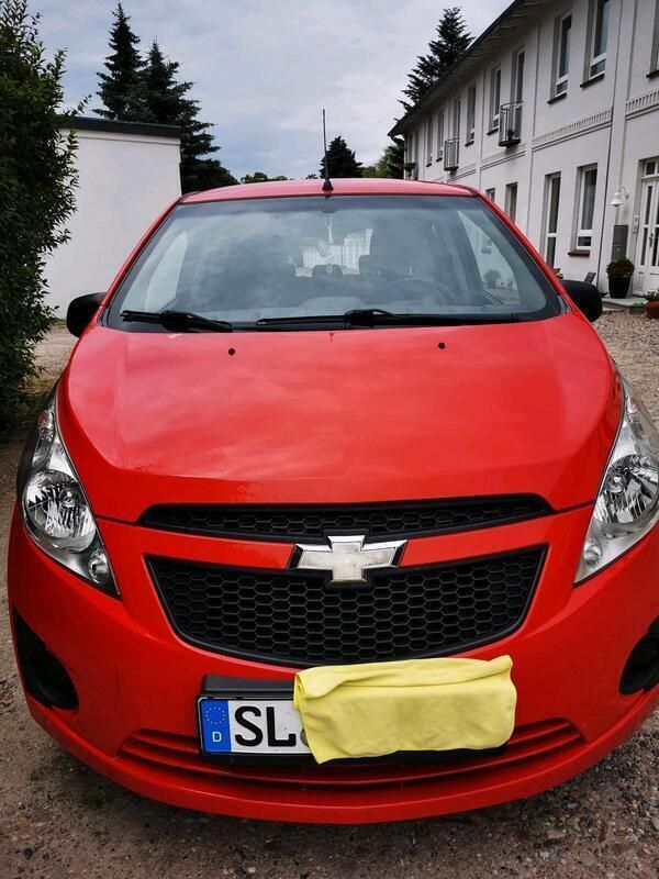 Rot Gebraucht 2012 Chevrolet Spark Kleinwagen | 2.600 € (Fairer Preis) - Bild 1/4