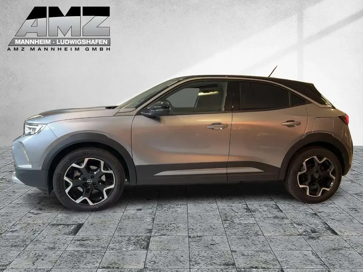 Gebraucht Opel Mokka-e Ultimate 100 kW (136 PS) 2022 Kontrast grau/quarz silber SUV