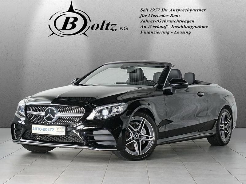 Obsidianschwarz (metallic) Gebraucht 2020 Mercedes C180 AMG Cabrio | 33.700 € (Fairer Preis) - Bild 1/4