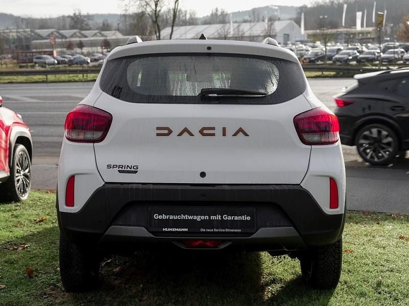 Gebraucht Dacia Spring Extreme 47 kW (65 PS) 2023 Polarweiss Kleinwagen