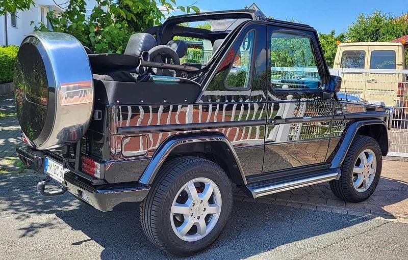 197 obsidianschwarz Gebraucht 1998 Mercedes G300 SUV | 125.500 € - Bild 1/4