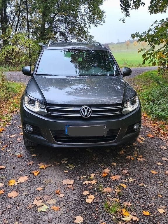 Grau Gebraucht 2014 VW Tiguan Cup SUV | 13.500 € (Fairer Preis) - Bild 1/4