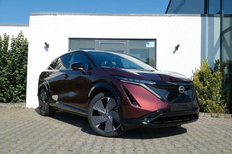 Xgg burgundy dach pearl black Neu 2025 Nissan Ariya Evolve SUV | 44.830 € (Superpreis) - Bild 1/4