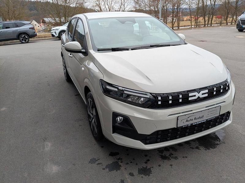 Neu Dacia Sandero Expression 101 PS (74 kW) 2026 Beige Limousine