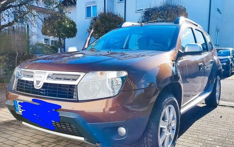 Braun Gebraucht 2011 Dacia Duster Prestige SUV | 6.790 € (Fairer Preis) - Bild 1/4