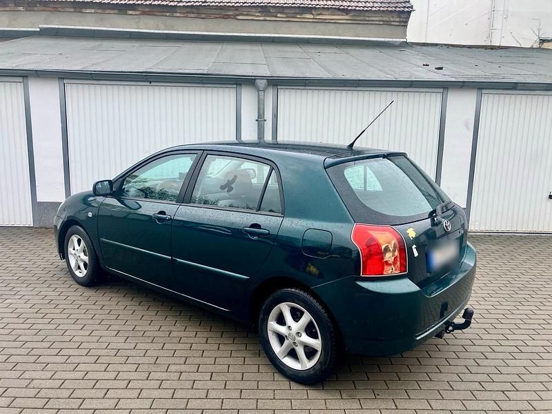 Usado Toyota Corolla 97 HP (71 kW) 2005 Verde Sedan