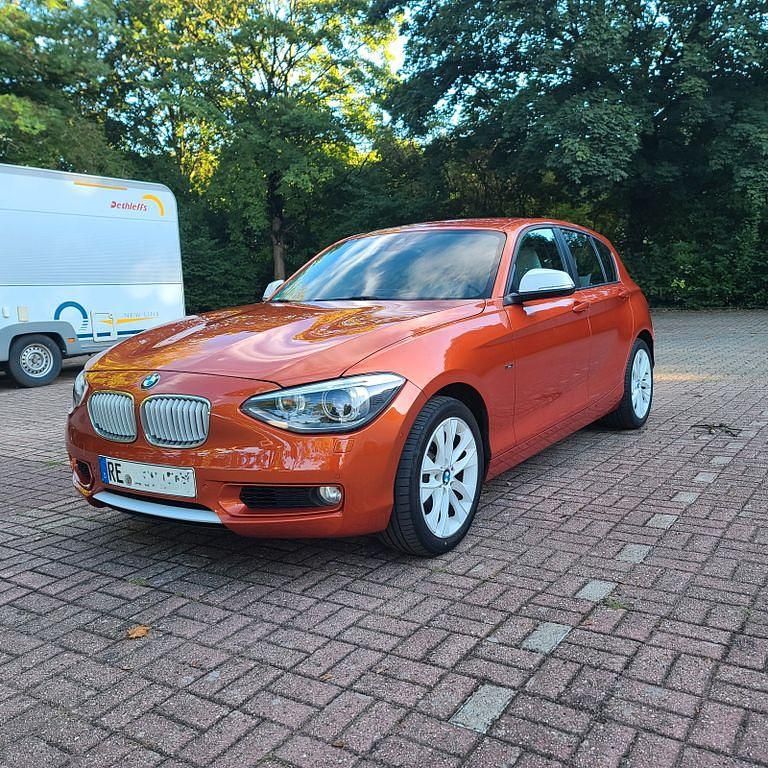 Orange Gebraucht 2011 BMW 120 Urban Line Kleinwagen | 11.900 € (Teuer) - Bild 1/4