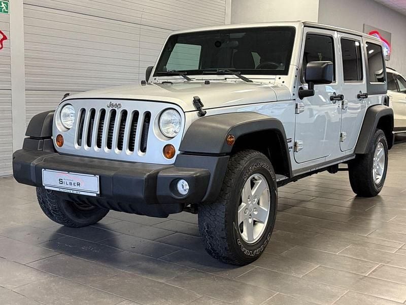 Silber Gebraucht 2012 Jeep Wrangler Unlimited Sport SUV | 23.890 € (Fairer Preis) - Bild 1/4