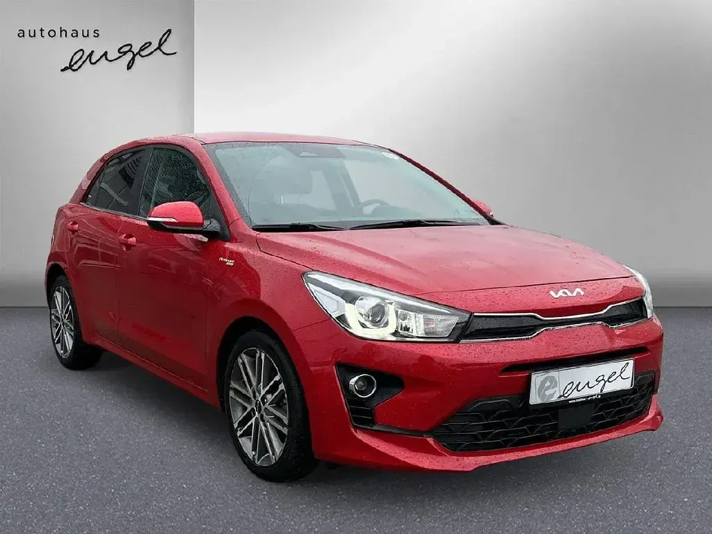 Gebraucht Kia Rio Platinum Edition 120 PS (88 kW) 2023 Signal rot metallic Limousine