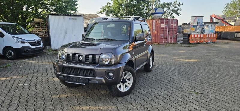 Schwarz Gebraucht 2013 Suzuki Jimny Style SUV | 9.900 € (Superpreis) - Bild 1/4