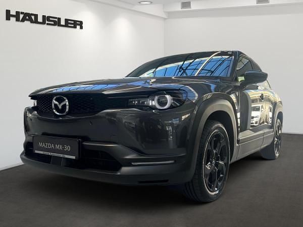 Grau (multitone machine grey mit schwarzem dach) Gebraucht 2025 Mazda MX30 SUV | 29.990 € (Etwas zu teuer) - Bild 1/4