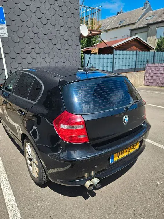 Gebraucht BMW 116 116 PS (85 kW) 2010 Schwarz Kleinwagen