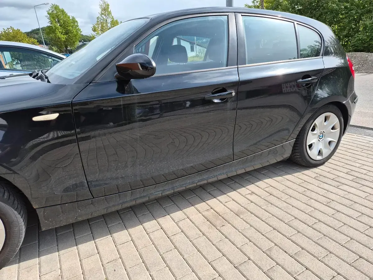 Używany BMW 116 122 KM (89 kW) 2009 Czarny Hatchback
