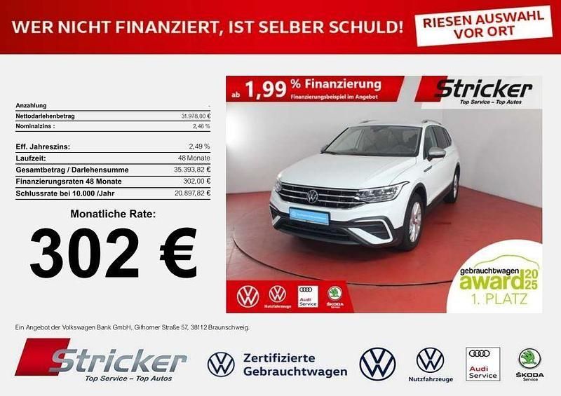 Weiß (pure white) Gebraucht 2024 VW Tiguan Allspace Life SUV | 31.978 € (Superpreis) - Bild 1/4