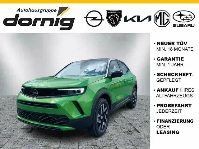 Ikone grün (metallic) Neu 2024 Opel Mokka Enjoy SUV | 25.990 € (Etwas zu teuer) - Bild 1/3