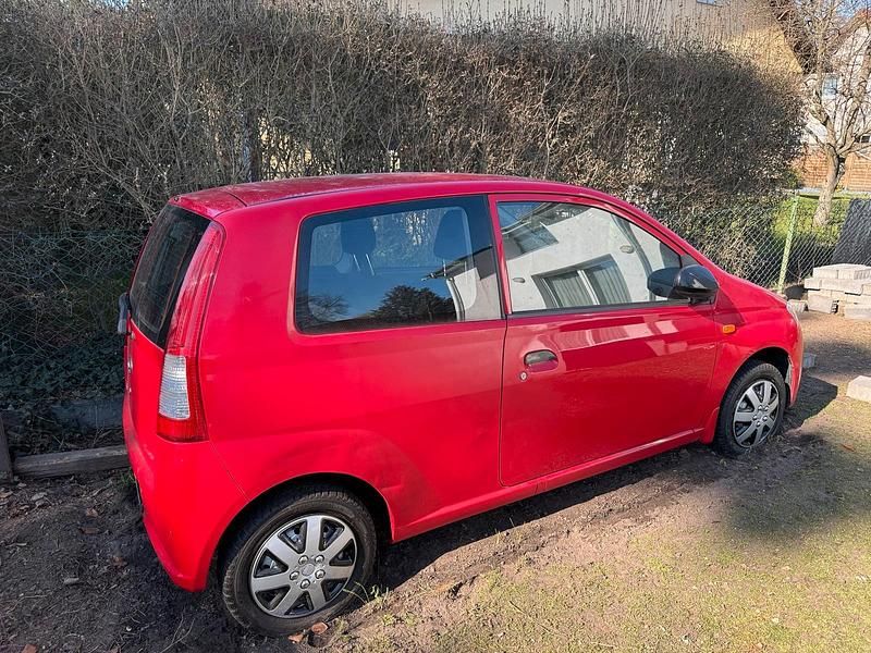 Gebraucht Daihatsu Cuore 59 PS (43 kW) 2003 Rot Kleinwagen