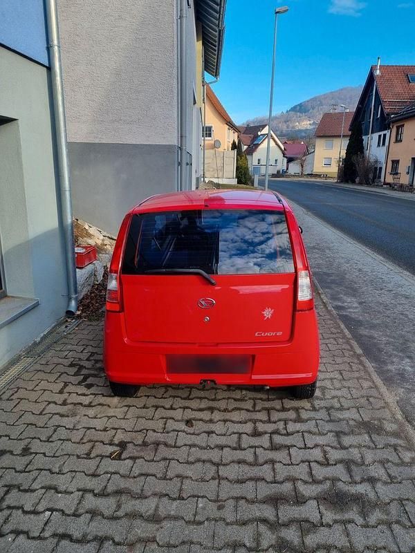 Gebraucht Daihatsu Cuore 58 PS (42 kW) 2005 Rot Kleinwagen