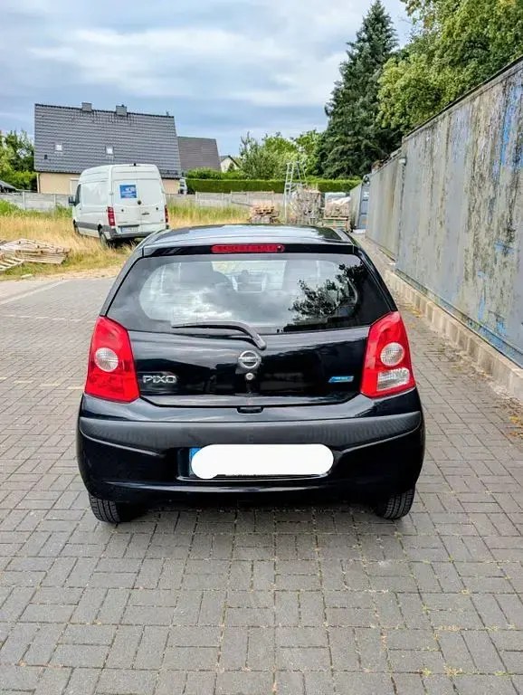 Gebraucht Nissan Pixo 68 PS (50 kW) 2009 Schwarz Kleinwagen