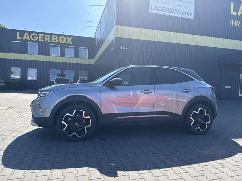 Gebraucht Opel Mokka-e Ultimate 100 kW (136 PS) 2022 Kontrast grau (silber) SUV