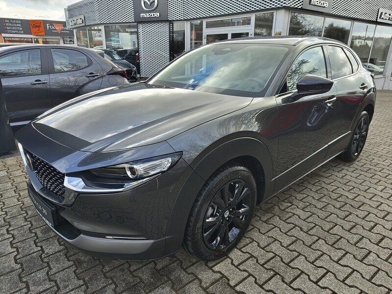 Machine gray Neu 2025 Mazda CX-30 Homura-Line SUV | 29.990 € - Bild 1/4