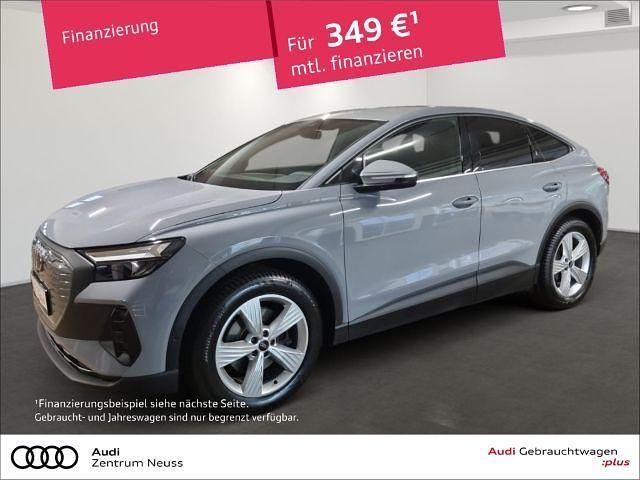 Grau Gebraucht 2022 Audi Q4 Sportback e-tron Sport SUV | 27.980 € (Fairer Preis) - Bild 1/3