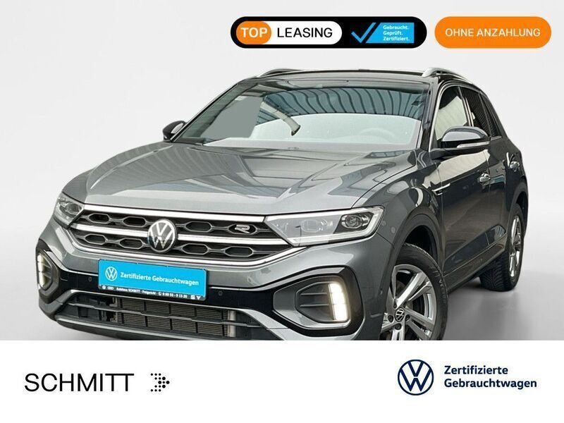 Indiumgrau metallic/schwarz Gebraucht 2024 VW T-Roc R-line SUV | 30.499 € (Fairer Preis) - Bild 1/3