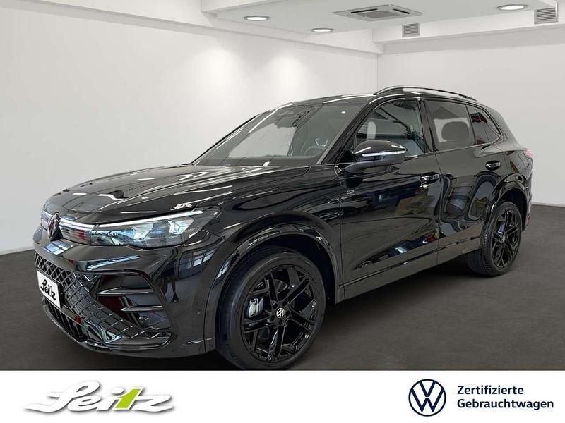 Grenadillschwarz metallic Gebraucht 2025 VW Tiguan R-line SUV | 55.248 € (Guter Preis) - Bild 1/4