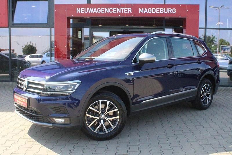 Atlantik blue metallic Gebraucht 2021 VW Tiguan Allspace Comfortline SUV | 32.500 € (Superpreis) - Bild 1/4