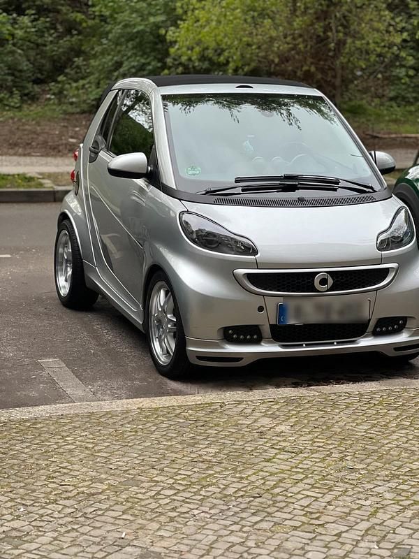 Silber Gebraucht 2013 Smart ForTwo Cabrio Brabus Cabrio | 7.990 € (Fairer Preis) - Bild 1/4